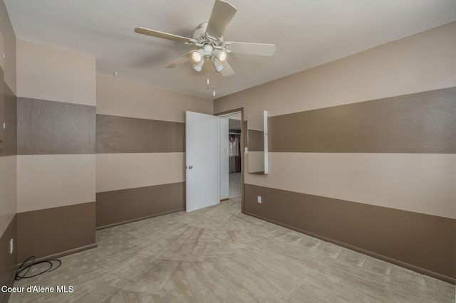 1502 N Melrose St, Coeur Dalene, ID 83814 - carpeted empty room with a ceiling fan