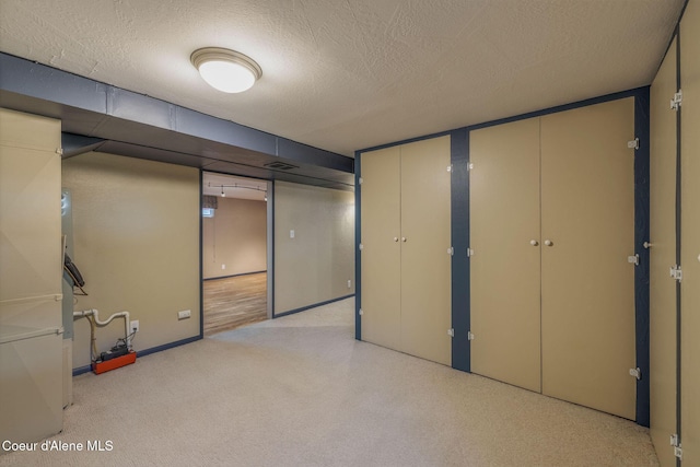 1502 N Melrose St, Coeur Dalene, ID 83814 - finished below grade area with a textured ceiling and light carpet