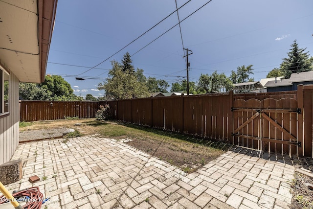 1502 N Melrose St, Coeur Dalene, ID 83814 - fenced backyard with a gate and a patio area