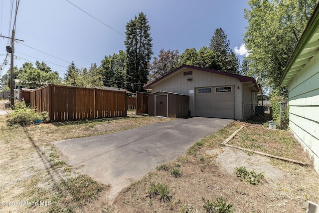 1502 N Melrose St, Coeur Dalene, ID 83814 - detached garage with asphalt driveway and a shed
