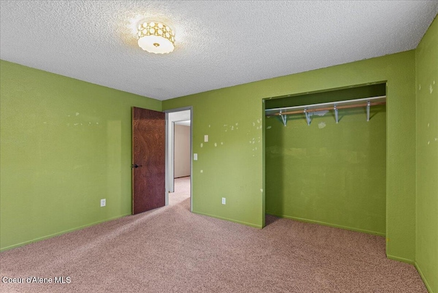 210 S Ross Point Rd, Post Falls, ID 83854 - unfurnished bedroom with carpet, a closet, and a textured ceiling