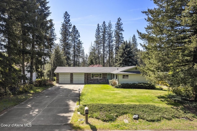 4206 W Appaloosa Rd, Coeur Dalene, ID 83815 - view of front of property featuring a garage, stone siding, concrete driveway, and a front lawn