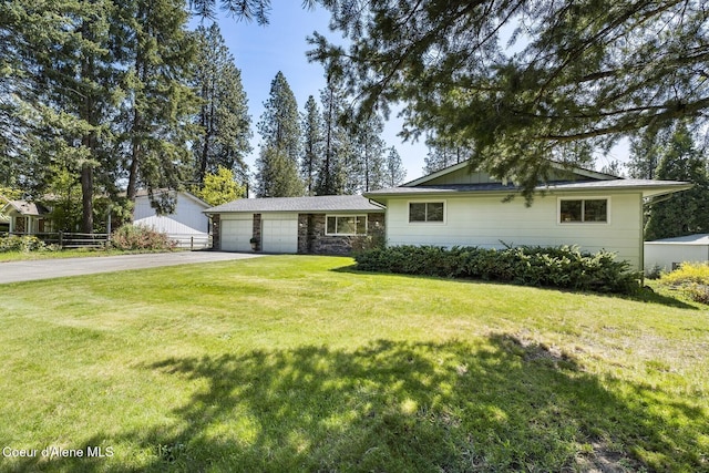 4206 W Appaloosa Rd, Coeur Dalene, ID 83815 - view of front of home with driveway, stone siding, and a garage
