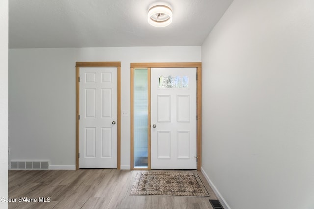 4206 W Appaloosa Rd, Coeur Dalene, ID 83815 - foyer with wood finished floors and baseboards