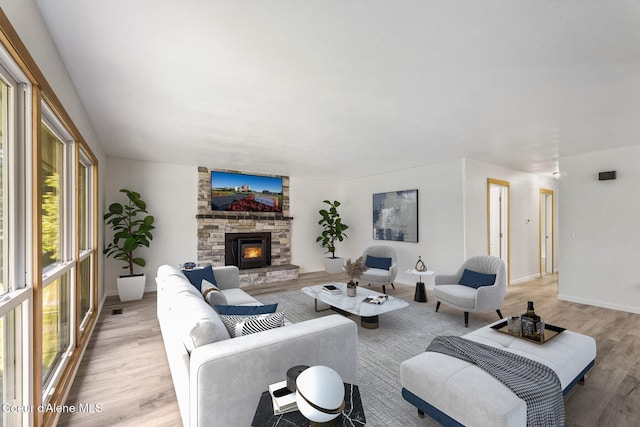 4206 W Appaloosa Rd, Coeur Dalene, ID 83815 - living area with plenty of natural light, light wood-type flooring, and a fireplace