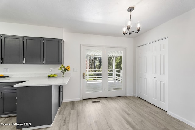 4206 W Appaloosa Rd, Coeur Dalene, ID 83815 - dining room featuring light wood finished floors and a chandelier
