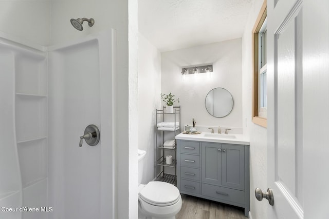 4206 W Appaloosa Rd, Coeur Dalene, ID 83815 - bathroom with a shower, vanity, and wood finished floors