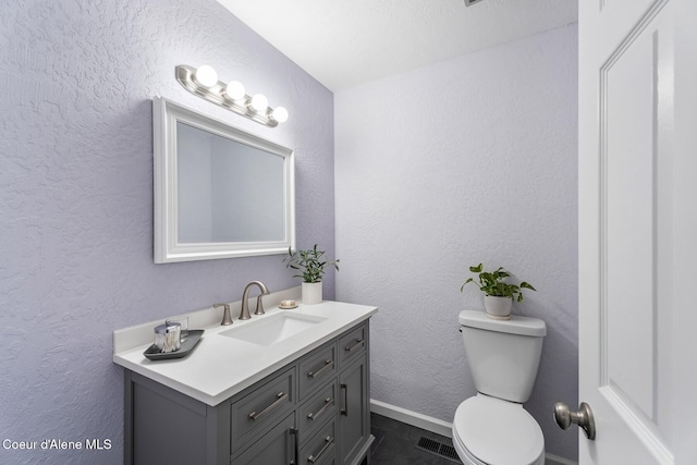 4206 W Appaloosa Rd, Coeur Dalene, ID 83815 - half bath featuring vanity and a textured wall