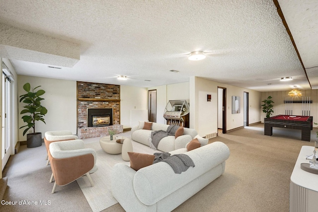 4206 W Appaloosa Rd, Coeur Dalene, ID 83815 - carpeted living room with a textured ceiling, billiards table, and a fireplace