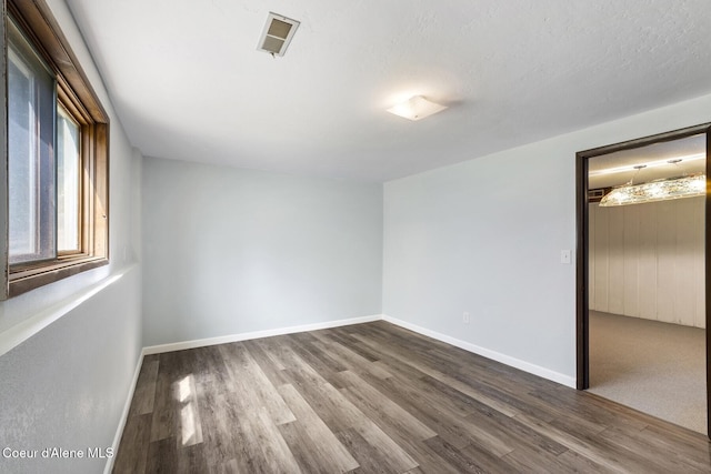 4206 W Appaloosa Rd, Coeur Dalene, ID 83815 - spare room with dark wood-style floors and baseboards