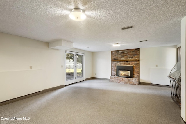 4206 W Appaloosa Rd, Coeur Dalene, ID 83815 - unfurnished living room with carpet, a fireplace, and a textured ceiling