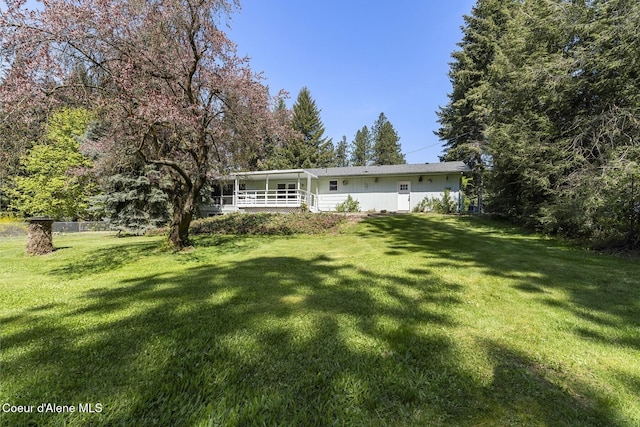 4206 W Appaloosa Rd, Coeur Dalene, ID 83815 - rear view of house with a yard
