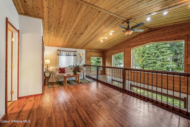 306 Scranton Ave, Coolin, ID 83821 - living area with a ceiling fan, rail lighting, lofted ceiling, wooden ceiling, and wood finished floors