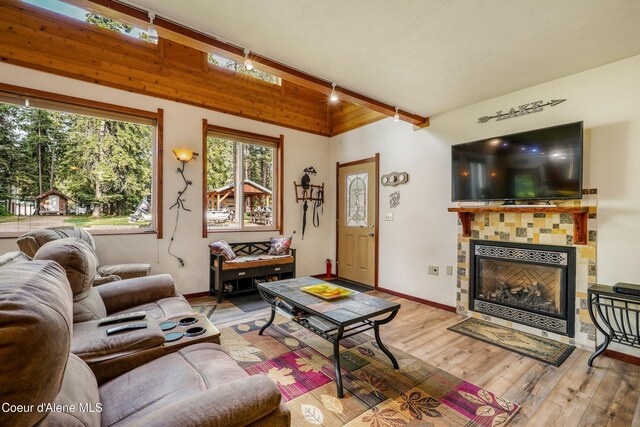 306 Scranton Ave, Coolin, ID 83821 - living area featuring wood finished floors and a tiled fireplace