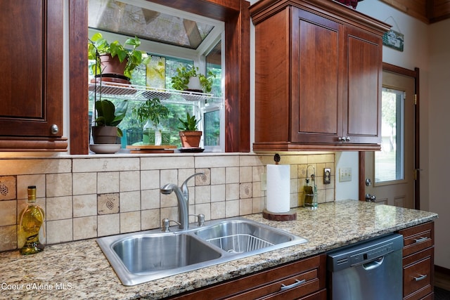 306 Scranton Ave, Coolin, ID 83821 - kitchen featuring stainless steel dishwasher, tasteful backsplash, and light stone countertops