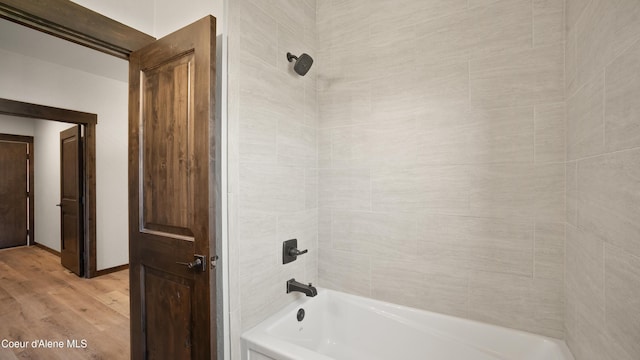 3306 Goodman Dr, Sandpoint, ID 83864 - full bathroom featuring wood finished floors and bathtub / shower combination