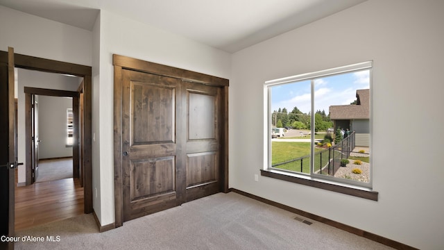 3306 Goodman Dr, Sandpoint, ID 83864 - unfurnished bedroom featuring carpet floors and a closet
