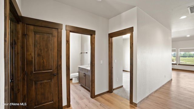 3306 Goodman Dr, Sandpoint, ID 83864 - hallway featuring light wood finished floors and recessed lighting