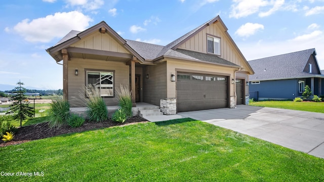 3306 Goodman Dr, Sandpoint, ID 83864 - craftsman-style house with board and batten siding, a front yard, concrete driveway, and a garage