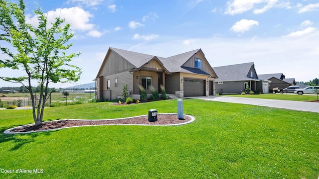 3306 Goodman Dr, Sandpoint, ID 83864 - view of front of property with board and batten siding, concrete driveway, and a garage