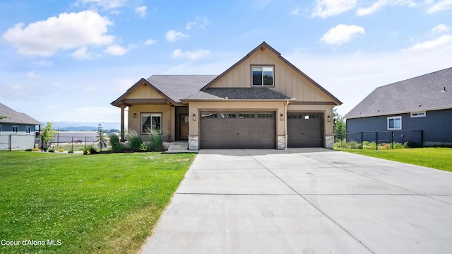 3306 Goodman Dr, Sandpoint, ID 83864 - craftsman inspired home featuring board and batten siding, concrete driveway, stone siding, an attached garage, and a mountain view