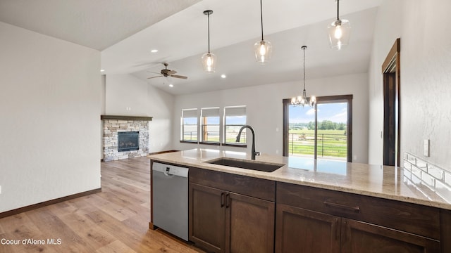 3306 Goodman Dr, Sandpoint, ID 83864 - kitchen with dishwasher, light wood-type flooring, ceiling fan, pendant lighting, and dark brown cabinetry