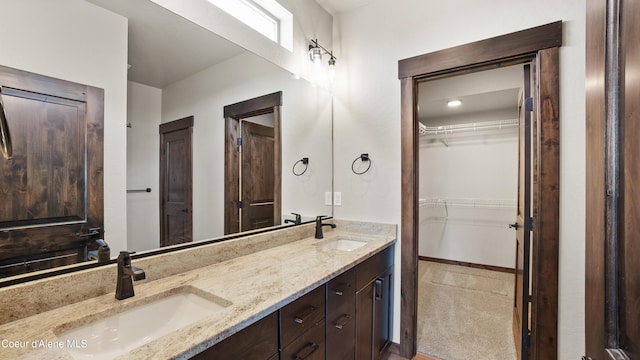 3306 Goodman Dr, Sandpoint, ID 83864 - bathroom featuring double vanity and a walk in closet