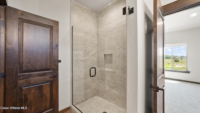 3306 Goodman Dr, Sandpoint, ID 83864 - bathroom featuring a shower stall and baseboards