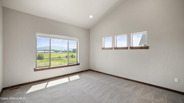 3306 Goodman Dr, Sandpoint, ID 83864 - carpeted spare room featuring lofted ceiling and recessed lighting