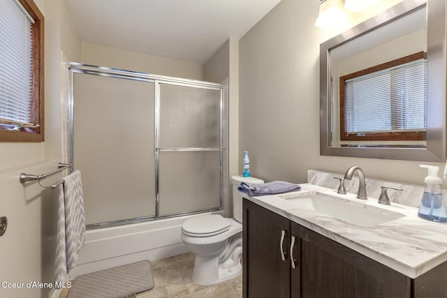 5421 W Fairway Ln # 23, Rathdrum, ID 83858 - bathroom featuring vanity and combined bath / shower with glass door