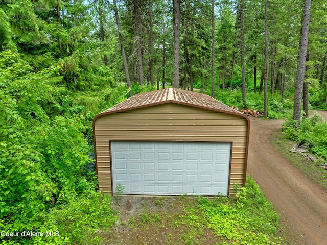 19565 N Goelzer Way, Rathdrum, ID 83858 - detached garage featuring a view of trees