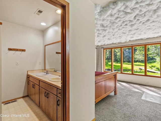 19565 N Goelzer Way, Rathdrum, ID 83858 - bathroom featuring double vanity and baseboards