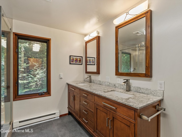 19565 N Goelzer Way, Rathdrum, ID 83858 - full bathroom featuring a baseboard heating unit and double vanity