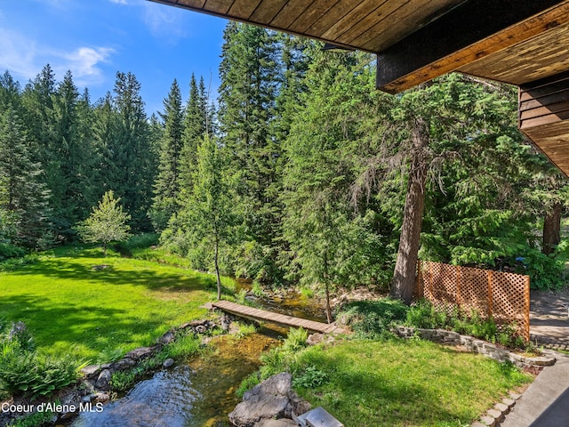 19565 N Goelzer Way, Rathdrum, ID 83858 - view of green lawn featuring a wooded view