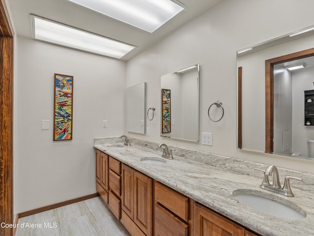 19565 N Goelzer Way, Rathdrum, ID 83858 - bathroom with double vanity and wood finished floors