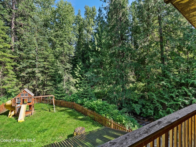 19565 N Goelzer Way, Rathdrum, ID 83858 - fenced backyard with a playground and a forest view
