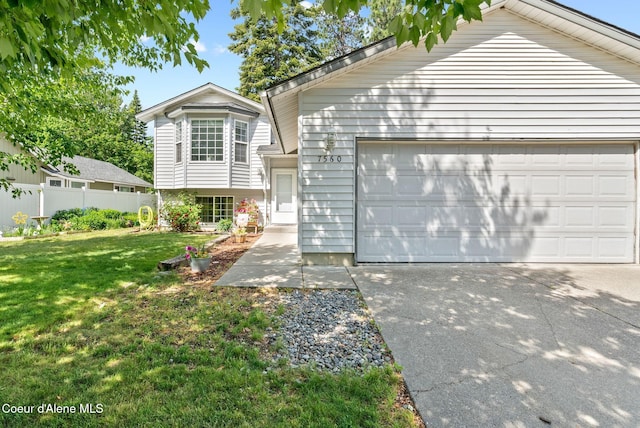 7560 W Sunrise St, Rathdrum, ID 83858 - split level home featuring a garage