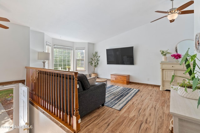 7560 W Sunrise St, Rathdrum, ID 83858 - living room featuring a ceiling fan, light wood finished floors, and vaulted ceiling
