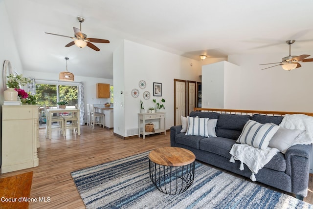 7560 W Sunrise St, Rathdrum, ID 83858 - living area with ceiling fan, light wood-type flooring, and vaulted ceiling
