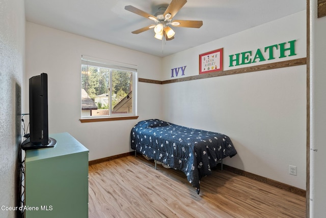7560 W Sunrise St, Rathdrum, ID 83858 - bedroom with wood finished floors and a ceiling fan