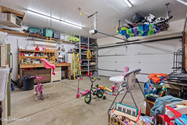 7560 W Sunrise St, Rathdrum, ID 83858 - garage featuring a garage door opener and a heating unit