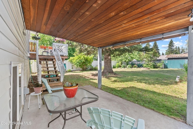 7560 W Sunrise St, Rathdrum, ID 83858 - fenced backyard featuring stairway and a patio