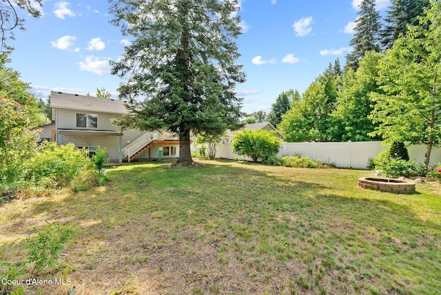 7560 W Sunrise St, Rathdrum, ID 83858 - view of yard with stairs and an outdoor fire pit