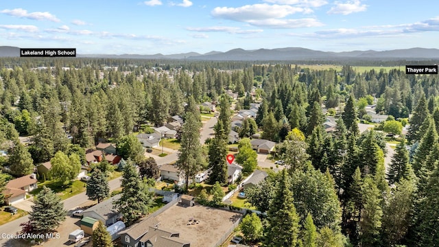 7560 W Sunrise St, Rathdrum, ID 83858 - aerial perspective of suburban area with a mountainous background and a forest