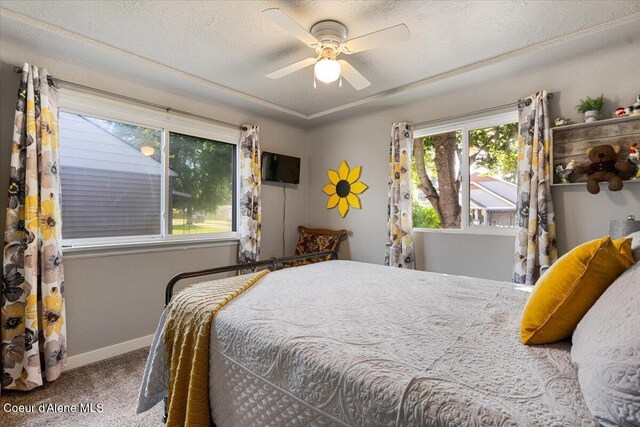 1318 N 10th St, Coeur Dalene, ID 83814 - carpeted bedroom featuring baseboards and ceiling fan