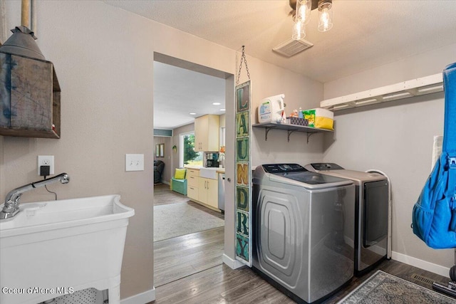 1318 N 10th St, Coeur Dalene, ID 83814 - washroom with independent washer and dryer and wood finished floors