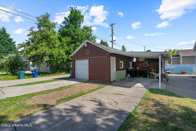 1318 N 10th St, Coeur Dalene, ID 83814 - view of front facade featuring driveway, an outbuilding, and a garage