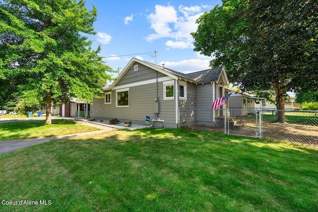 1318 N 10th St, Coeur Dalene, ID 83814 - view of side of home featuring a shingled roof