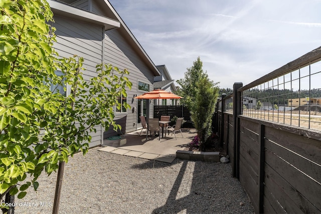 2999 N Casa Ct, Coeur Dalene, ID 83814 - fenced backyard featuring a patio
