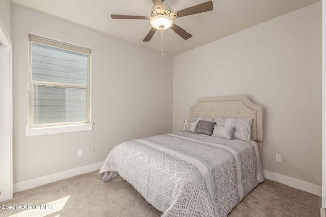 2999 N Casa Ct, Coeur Dalene, ID 83814 - carpeted bedroom with baseboards and a ceiling fan